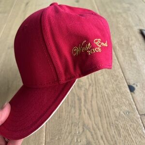 The West End Hotel in Nice, France red baseball hat